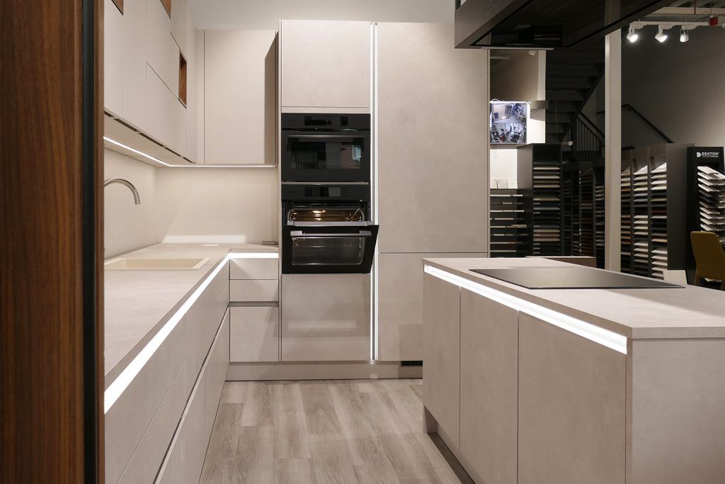 Handleless modern kitchen display in Victoria Kitchens showroom, Charlton SE7