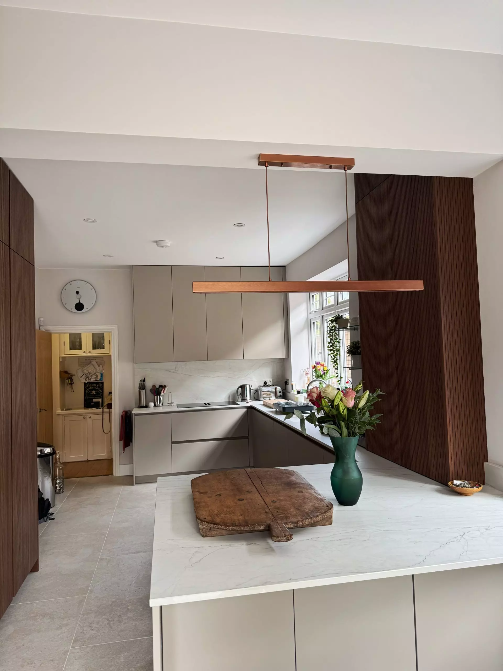 German manufactured handleless cabinetry with precision-aligned recessed rail in a Victoria Kitchens modern kitchen