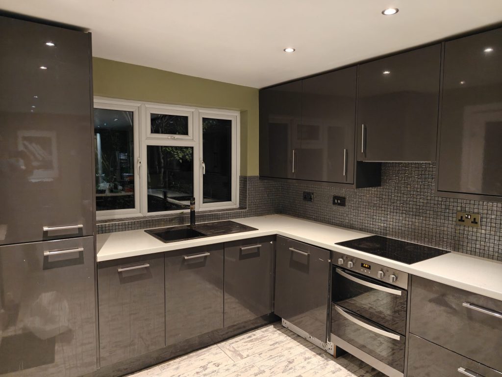 Outdated grey gloss kitchen before renovation, Charlton, SE7