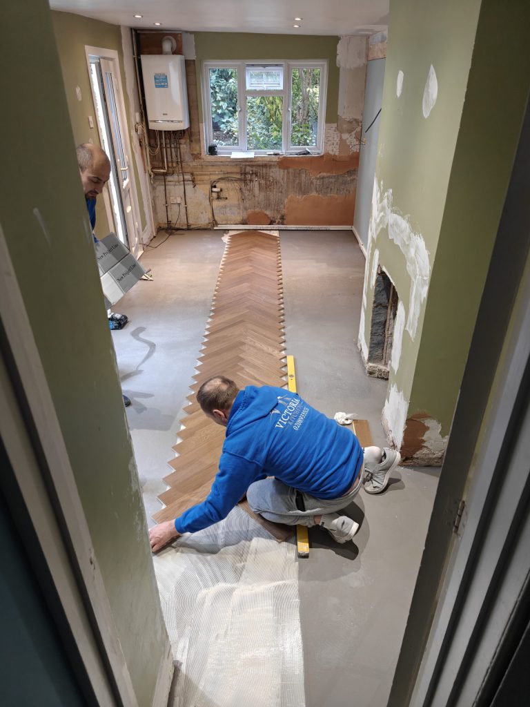 Victoria Kitchens installation team fitting a bespoke kitchen in a home across South East London