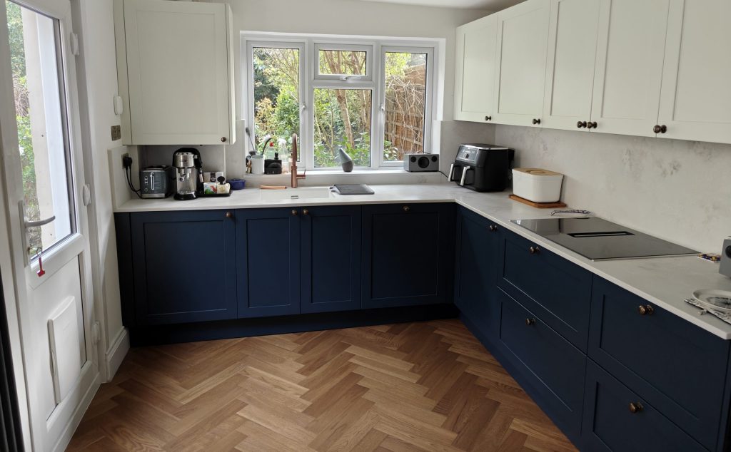 Completed Caledonia Classic Kintyre shaker kitchen in Farrow and Ball Hague Blue with Stone Sense quartz worktops