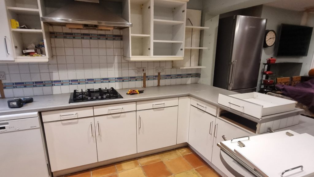 Outdated white kitchen before renovation, prior to Victoria Kitchens installation
